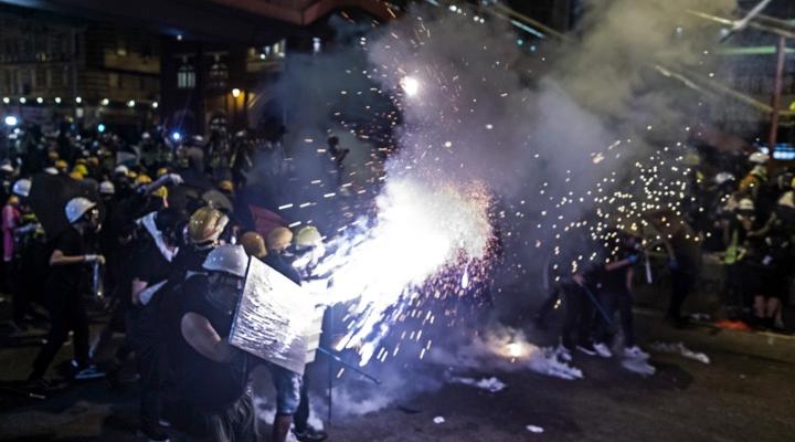 Thousands march in Hong Kong as police use tear gas on crowds