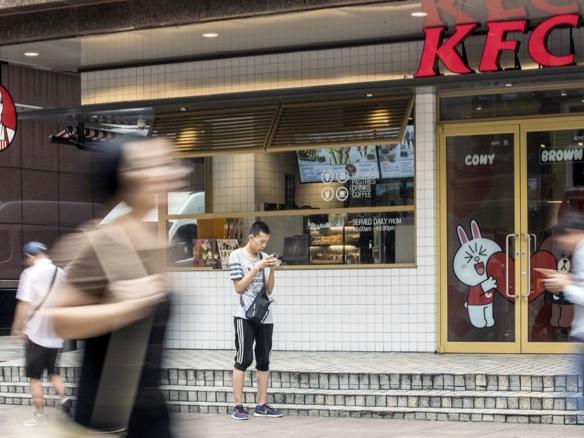 Yum China banks on robot servers, AI menus to defy slowdown