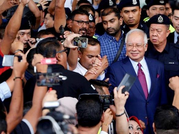 Najib finally nabbed, but what does this mean for Singapore?