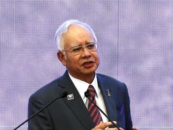 Najib unveils voter-friendly budget ahead of election fight