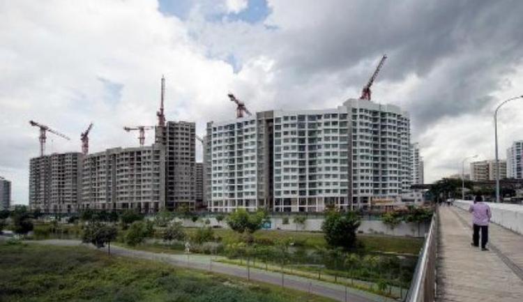 Not yet time to ease property cooling measures, says MAS