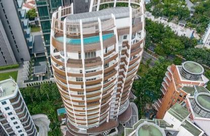 What does the recent spurt in en-bloc sales mean?